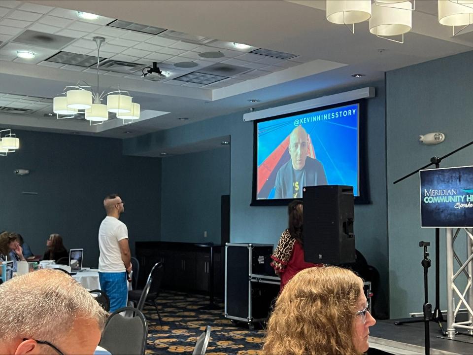 An attendee asks suicide survivor and public speaker Kevin Hines a question at the annual Meridian Community Health Speaker Series at the Holiday Inn in Richmond Wednesday, Sep. 27, 2023. Hines was this year's speaker and the topic was suicide prevention to recognize September as National Suicide Prevention and Awareness Month.