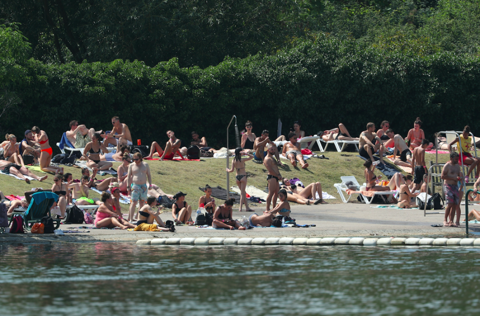 People sunbathe in Hyde Park as temperatures continue to climb (PA)