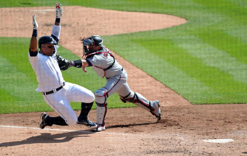 Detroit Tigers first baseman Miguel Cabrera (24) is tagged out at home by Minnesota Twins catcher Mitch Garver (8) during sixth inning action on Wednesday, April 7, 2021, at Comerica Park in Detroit.