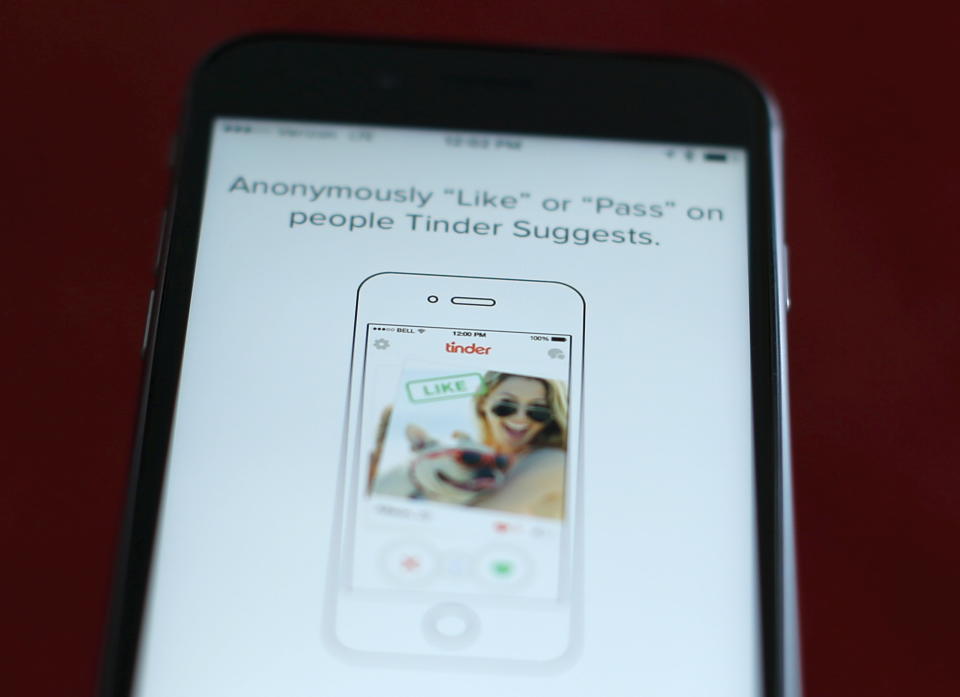 The dating app Tinder is shown on an Apple iPhone in this photo illustration taken February 10, 2016. Just in time for Valentine's Day, a survey shows that more Americans are looking for love through online dating, with more than four times as many young adults using mobile apps than in 2013.  REUTERS/Mike Blake/Illustration