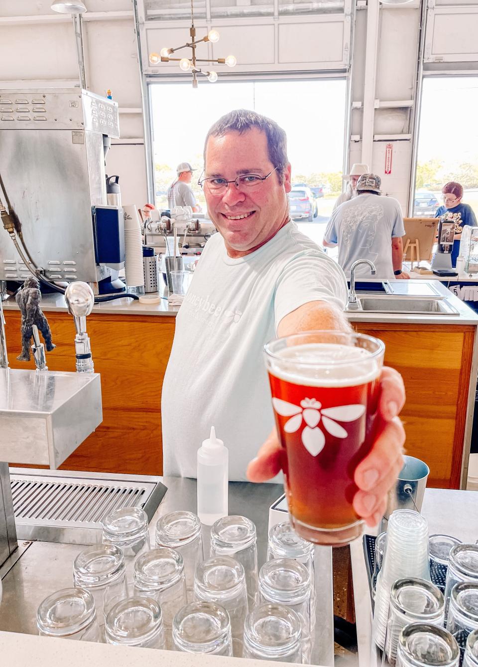 Honeybee Coffee & Brewery's head brewer, Steve Dedman, celebrates the release of seven new beers at a release party on April 23, 2022. Dedman may eventually brew some high gravity beers, but for now he said he tends to stay in the 5-7% ABV range (Alcohol by Volume), sometimes a little higher or lower.