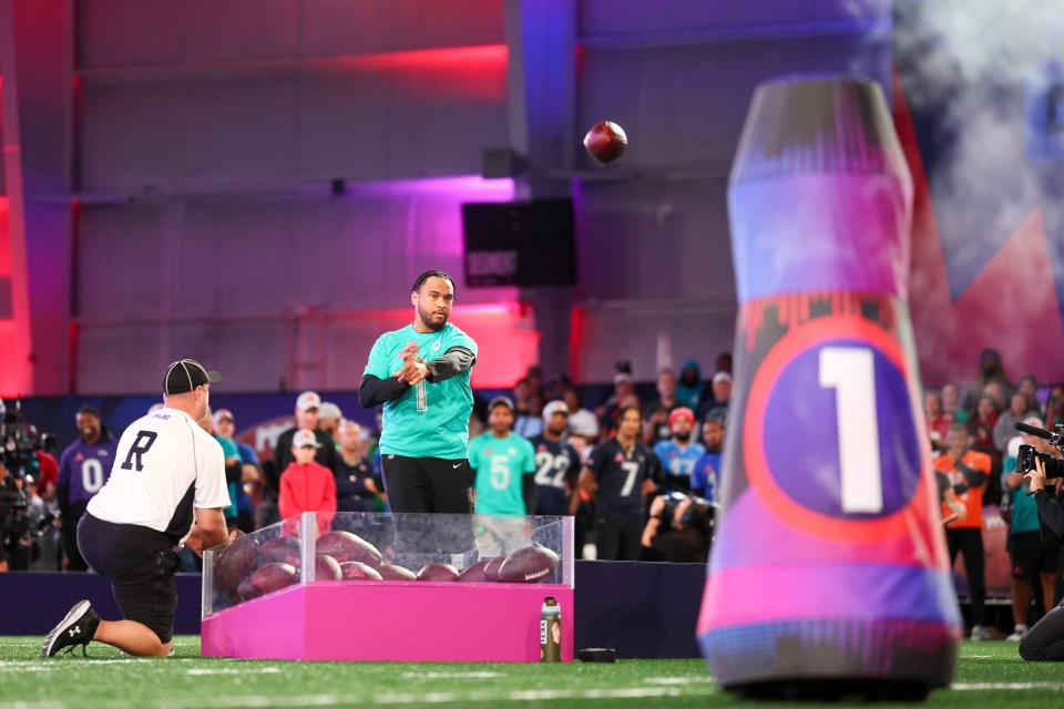 Feb 1, 2024; Orlando, FL, USA; Miami Dolphins quarterback Tua Tagovailoa (1) participates in the NFL Pro Bowl Skills Competition at the UCF NIcholson Fieldhouse. Mandatory Credit: Nathan Ray Seebeck-USA TODAY Sports