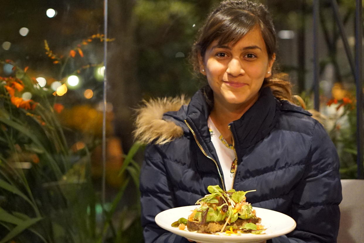 Lisa Ram&iacute;rez encounters avocado toast at Azahar Coffee in Bogota, Colombia. (Photo: Eve Hartley)