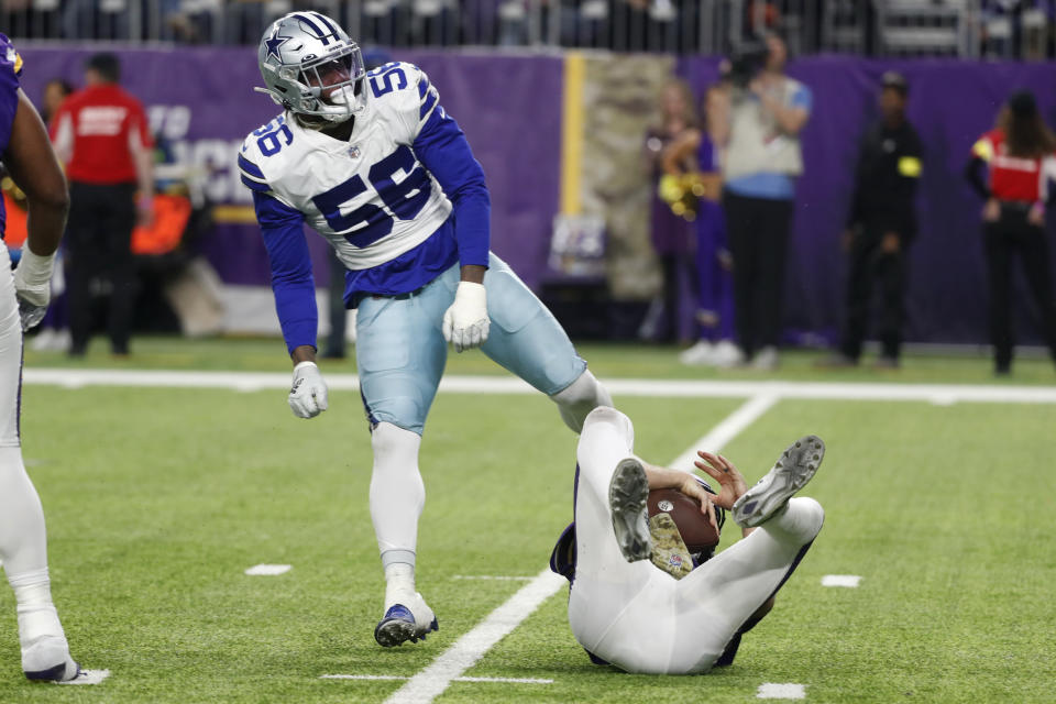 Dallas Cowboys defensive end Dante Fowler Jr. (56) celebrates after sacking Minnesota Vikings quarterback Kirk Cousins during the second half of an NFL football game, Sunday, Nov. 20, 2022, in Minneapolis. (AP Photo/Bruce Kluckhohn)