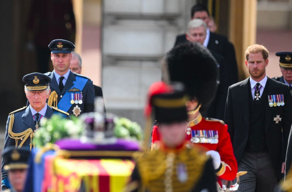 The Prince of Wales and Prince Harry stood side-by-side behind King Charles as they walked behind the Queen's coffin. (Getty)