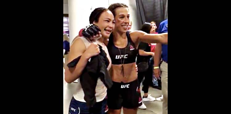 Joanna Jedrzejczyk and Michelle Waterson exchange jerseys