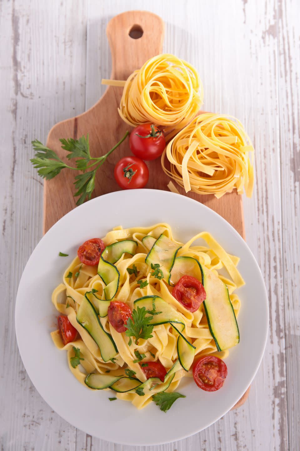 <p>Tagliatelle is a long, ribbon-shaped pasta that's similar to fettuccine. In fact, some people say they’re actually <a href="https://www.popsugar.com/food/Difference-Between-Fettuccine-Tagliatelle-41945041" rel="nofollow noopener" target="_blank" data-ylk="slk:the exact same thing" class="link ">the exact same thing</a>! This pasta is usually known as fettuccine in Rome and Southern Italy, while Northern Italians typically refer to it as tagliatelle. Often server with a rich meat sauce, like bolognese, it's also delicious with fresh vegetables.</p><p><strong>Try it in<a href="https://www.countryliving.com/food-drinks/recipes/a31162/tagliatelle-pesto-asparagus-shrimp-recipe-rbk0412/" rel="nofollow noopener" target="_blank" data-ylk="slk:Tagliatelle with Pesto, Asparagus, and Shrimp" class="link "> Tagliatelle with Pesto, Asparagus, and Shrimp</a></strong></p>
