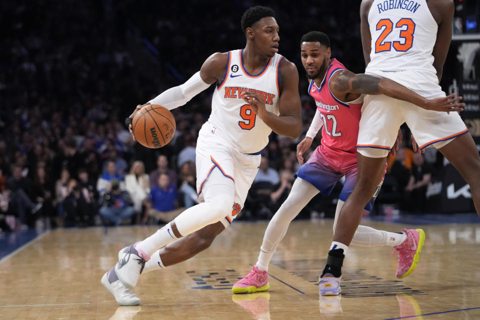 New York Knicks guard RJ Barrett (9) drives against Washington Wizards guard Monte Morris (22) during the first half of an NBA basketball game Wednesday, Jan. 18, 2023, at Madison Square Garden in New York. (AP Photo/Mary Altaffer)