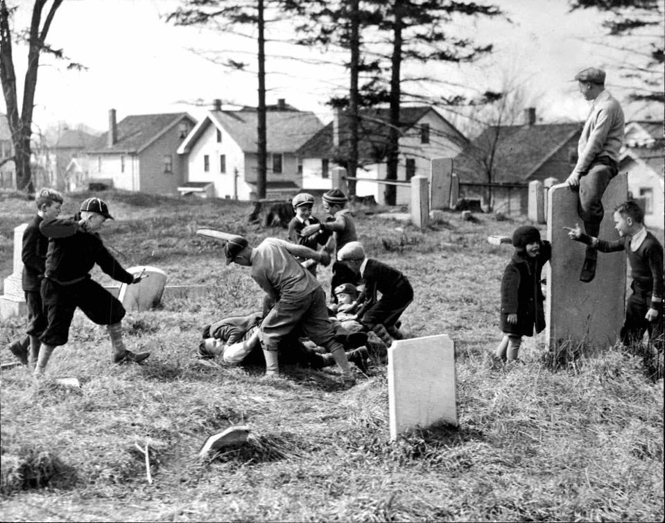 Children playing in Rapids Cemetery in 1934. Times-Union, April 5, 1934.