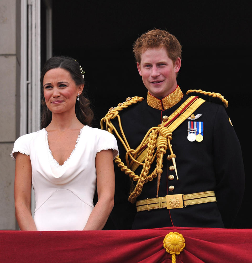 Pippa Middleton and Prince Harry appear on the balcony of Buckingham Palace, London, following the wedding of Prince William and Kate Middleton at Westminster Abbey, Friday April 29, 2011. (AP Photo/John Stillwell, Pool)