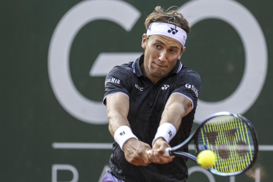 Casper Ruud of Norway, returns a ball to Nicolas Jarry of Chile during their quarter-final match at the Geneva Open tennis tournament in Geneva, Switzerland, Thursday, May 25, 2023. (Martial Trezzini/Keystone via AP)