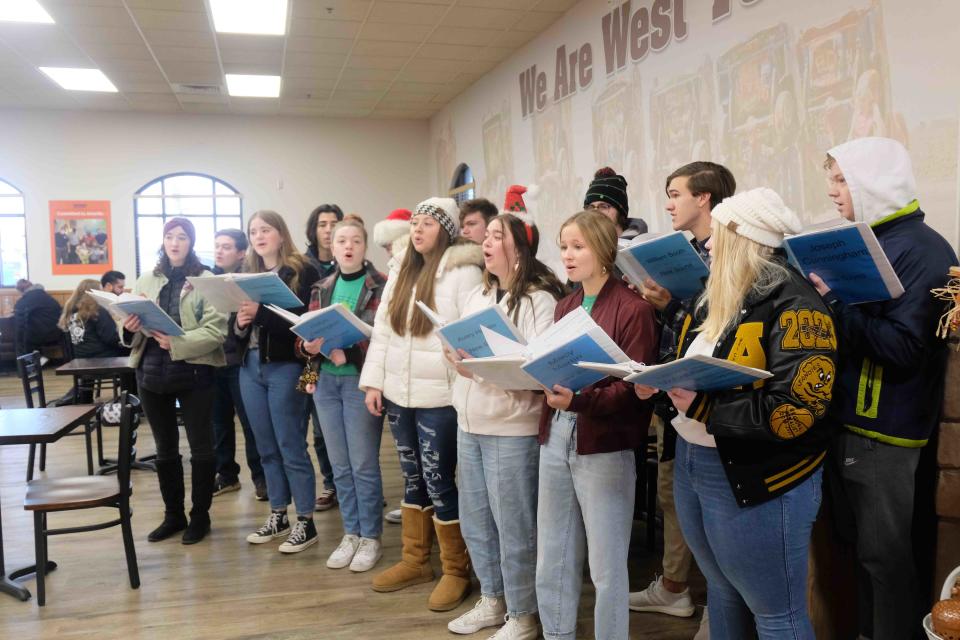 The Amarillo High School New Sound Singers entertain customers at United Supermarkets Saturday during the Salvation Army's Red Kettle Campaign kick-off event in southwest Amarillo.