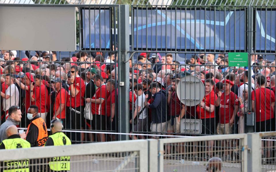 Liverpool fans stand outside prior to the UEFA Champions League final football match - AFP