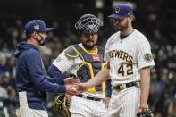 Milwaukee Brewers manager Craig Counsell take starting pitcher Adrian Houser out of the game during the fifth inning of a baseball game against the Pittsburgh Pirates Friday, April 16, 2021, in Milwaukee. (AP Photo/Morry Gash)
