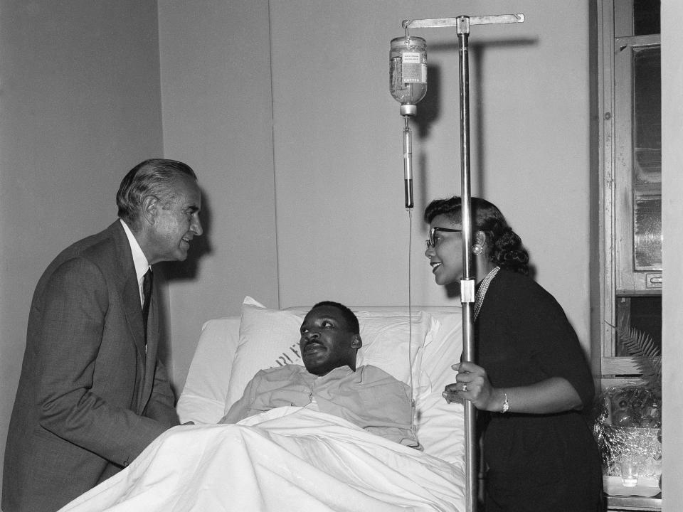 Averell Harriman and Coretta Scott King standing at MLK's bedside