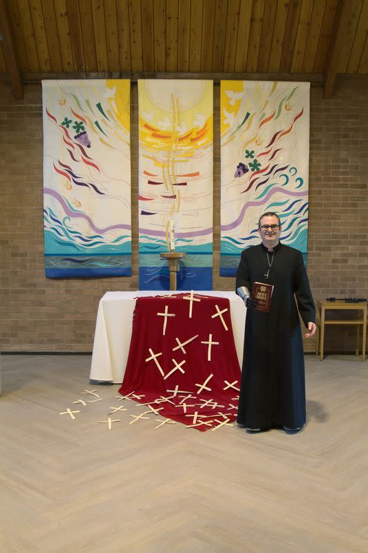 Priest-in-training Daniel Cant demonstrates his bionic arm by British company Open Bionics at Christ Church in Colchester