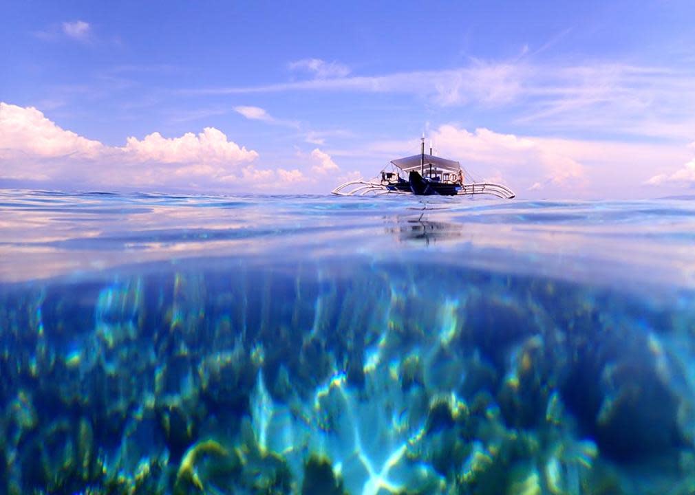 Seascape from the wayer on a sunny day at Balicasag Island Cliff near Panglao, Bohol, Phillipines