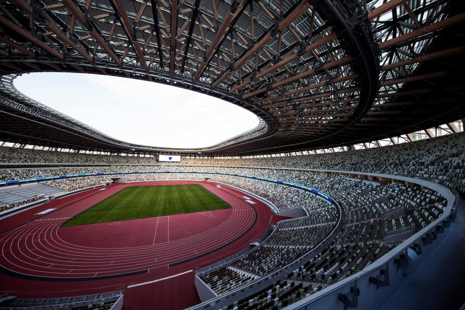 The National Stadium, venue for the upcoming Tokyo 2020 Olympic Games, is seen during a media tour following the the stadium's completion in Tokyo on December 15, 2019. - The Tokyo 2020 Olympics organisers on December 15 celebrated the completion of the main stadium that features use of lumber and other Japanese architectural tradition, seven months before the Opening Ceremony. (Photo by Behrouz MEHRI / AFP) (Photo by BEHROUZ MEHRI/AFP via Getty Images)