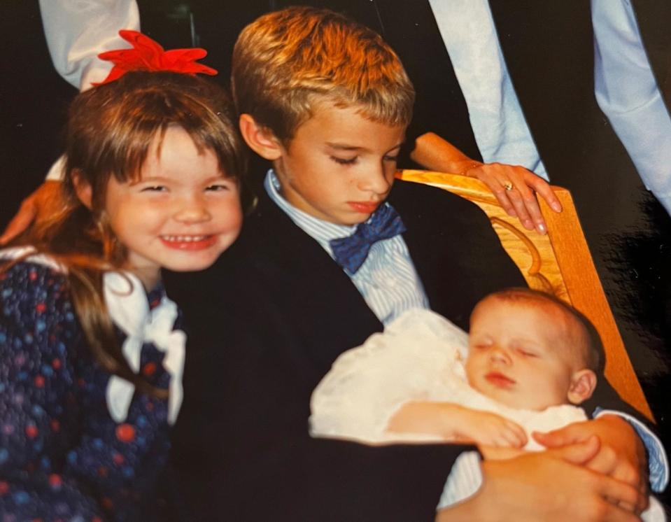 PHOTO: Sean Cullen, as a child, holds his brother Kevin at his baptism in 1994. (Courtesy of Sean Cullen)