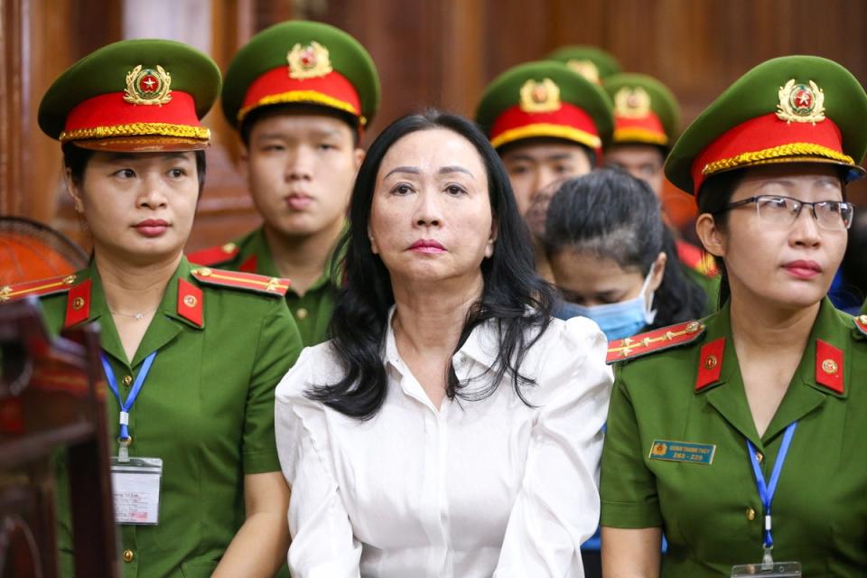 Truong My Lan, centre, chair of Van Thinh Phat Holdings, sits during her trial at in Ho Chi Minh City  ((EPA))