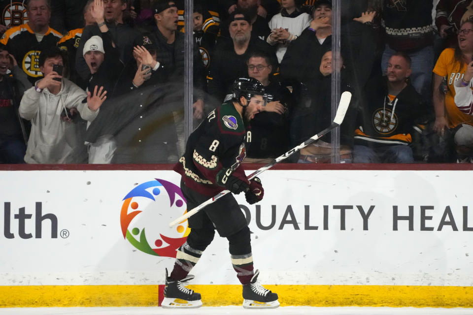 Arizona Coyotes center Nick Schmaltz celebrates overtime goal against the Boston Bruins in an NHL hockey game Tuesday, Jan. 9, 2024, in Tempe, Ariz. The Coyotes won 4-3. (AP Photo/Ross D. Franklin)