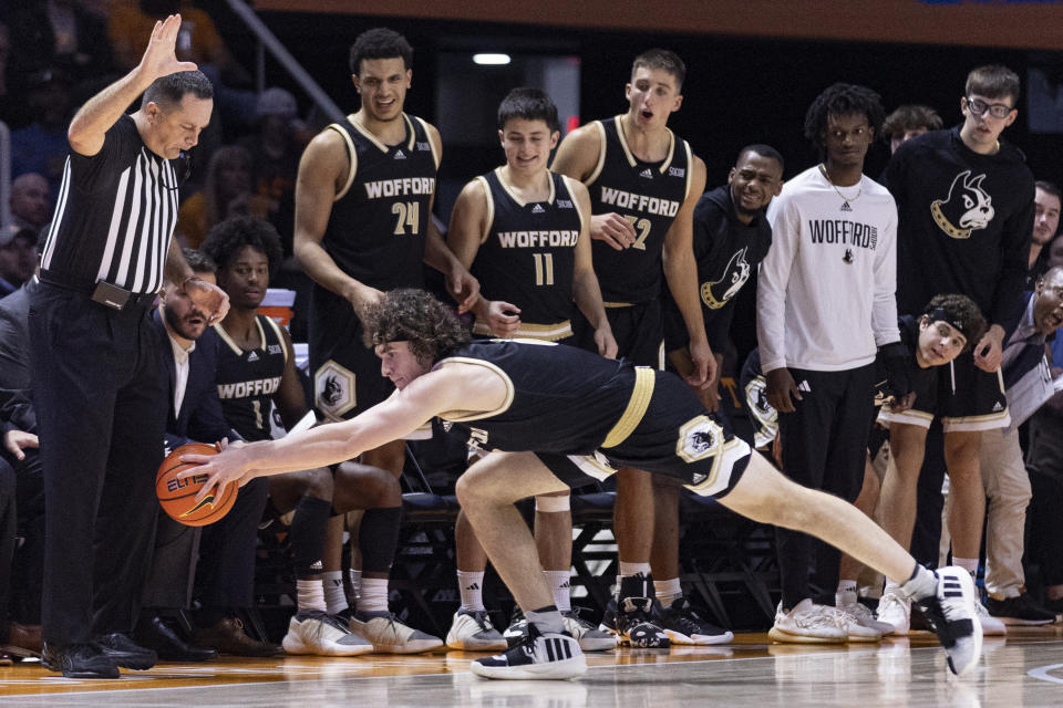 Wofford guard Jackson Sivills (0) tries to save the ball from going out of bounds during the second half of the team's NCAA college basketball game against Tennessee on Tuesday, Nov. 14, 2023, in Knoxville, Tenn. (AP Photo/Wade Payne)