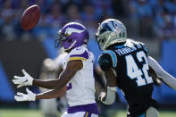 Minnesota Vikings long snapper Andrew DePaola (42) bobbles a punt return against Carolina Panthers safety Sam Franklin (42) during the second half of an NFL football game, Sunday, Oct. 17, 2021, in Charlotte, N.C. (AP Photo/Gerald Herbert)