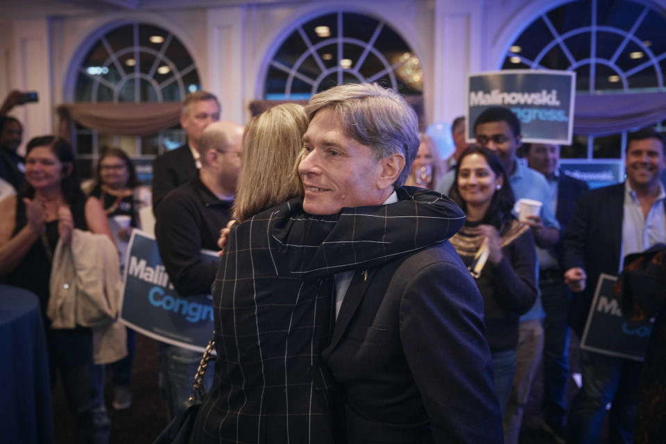 Democratic Rep. Tom Malinowski, center right, arrives during his election night party in Garwood, N.J., Tuesday, Nov. 8, 2022. (AP Photo/Andres Kudacki)