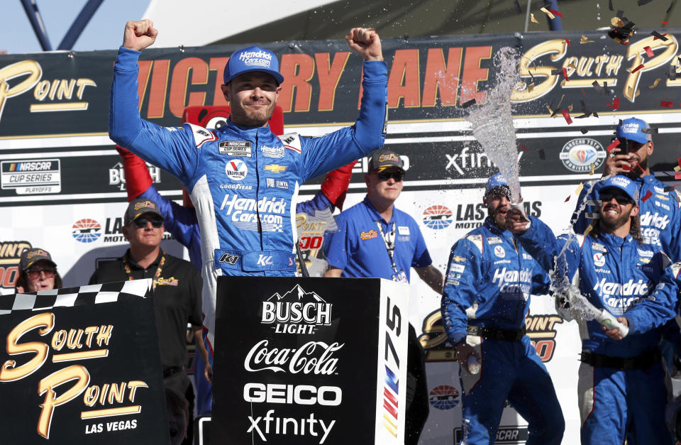 Kyle Larson (5) celebrates in Victory Lane after winning a NASCAR Cup Series auto race, Sunday, Oct. 15, 2023, in Las Vegas. (AP Photo/Steve Marcus)