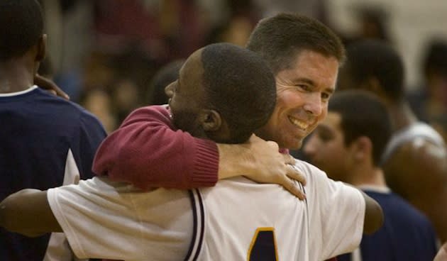 Collingswood coach Joe McLoughlin celebrates a victory with a player — Philadelphia Inquirer