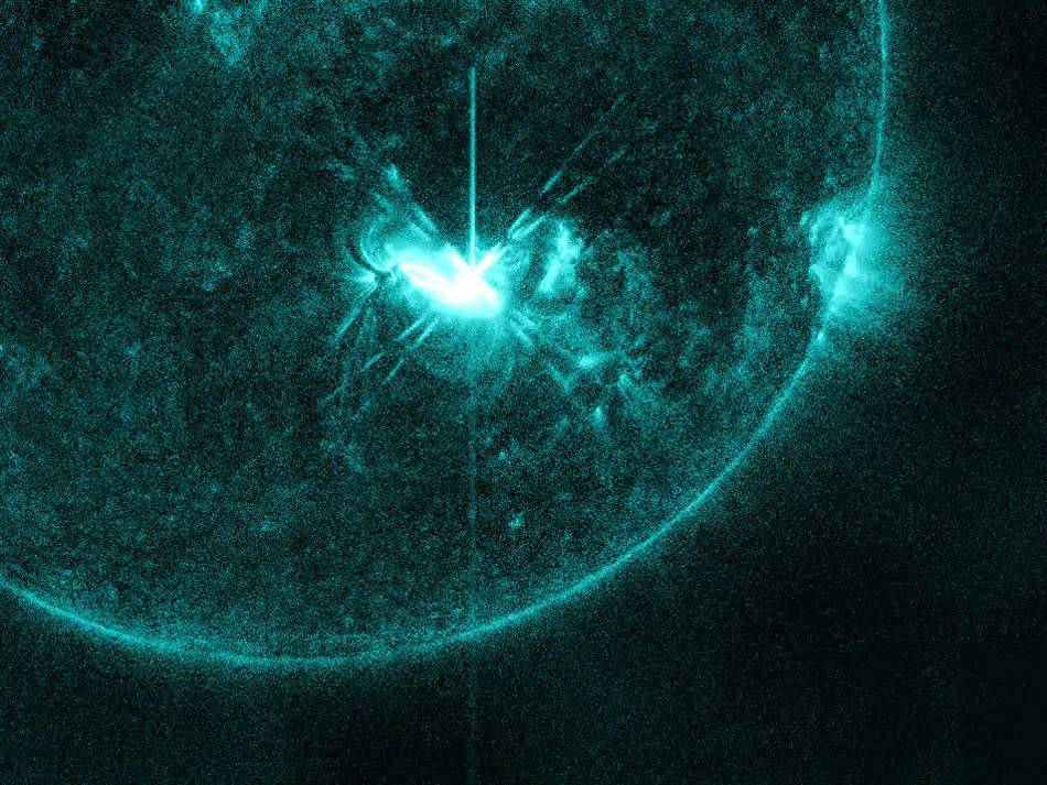 This NASA image, captured by the Solar Dynamics Observatory, shows the M5.3 class solar flare that peaked on July 4, 2012, at 5:55 AM EDT. The flare is shown in the 131 Angstrom wavelength, a wavelength that is particularly good for capturing the radiation emitted from flares. The wavelength is typically colorized in teal as shown here.