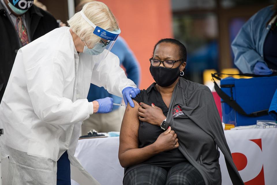 Tammi Brown, Nurse Manager for the Chatham County Health Dept., is given the Pfizer vaccine for COVID-19 at the Chatham County Health Department. Brown was among the first in Savannah, Georgia, to receive the vaccine.