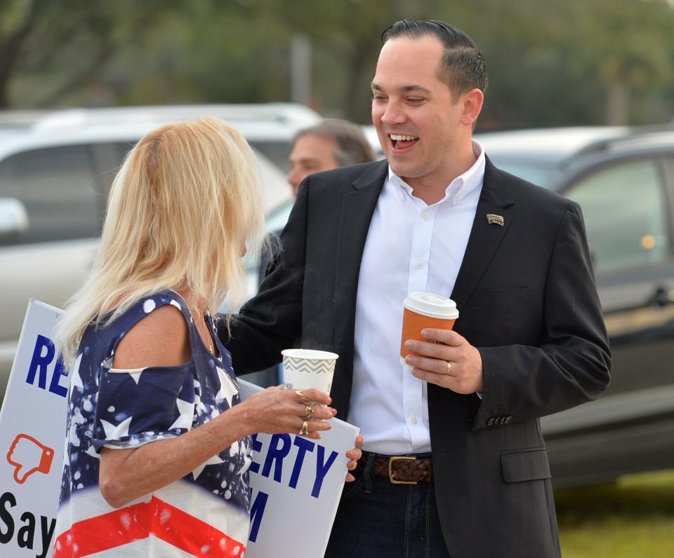 Anthony Sabatini, chair of the Lake County GOP, speaks to a GOP activist in Sarasota Friday. Republican activists gathered to protest Republican National Committee Chair Ronna McDaniel and oppose her reelection. Sabatini forced a meeting of the Republican Party of Florida's executive committee to consider a vote of no confidence on McDaniel's leadership, but they didn't have a quorum Friday and no vote was taken. About 150 people participated in the rally outside the meeting.