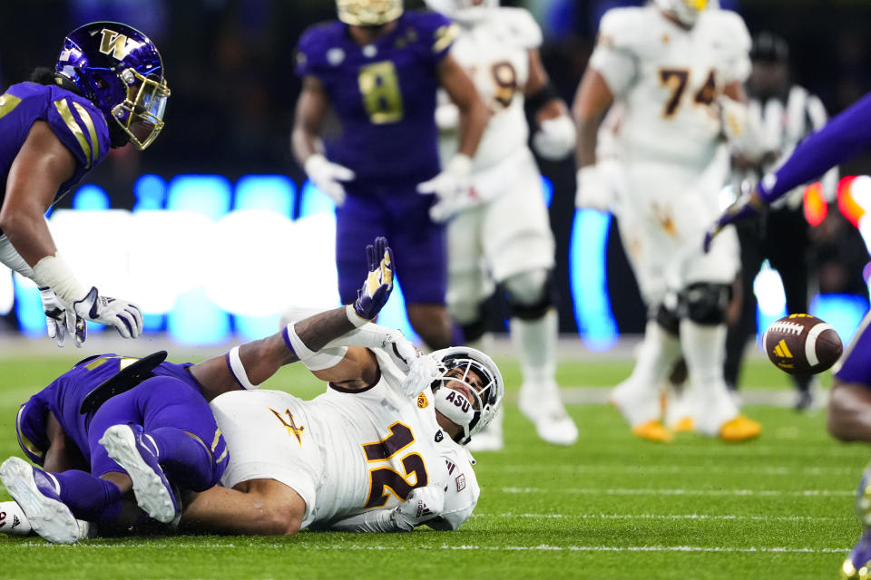 Arizona State tight end Jalin Conyers (12) reacts as Washington cornerback Dominique Hampton, bottom left, breaks up a pass on fourth down for a turnover with less than a minute remaining during the second half of an NCAA college football game Saturday, Oct. 21, 2023, in Seattle. Washington won 15-7. (AP Photo/Lindsey Wasson)