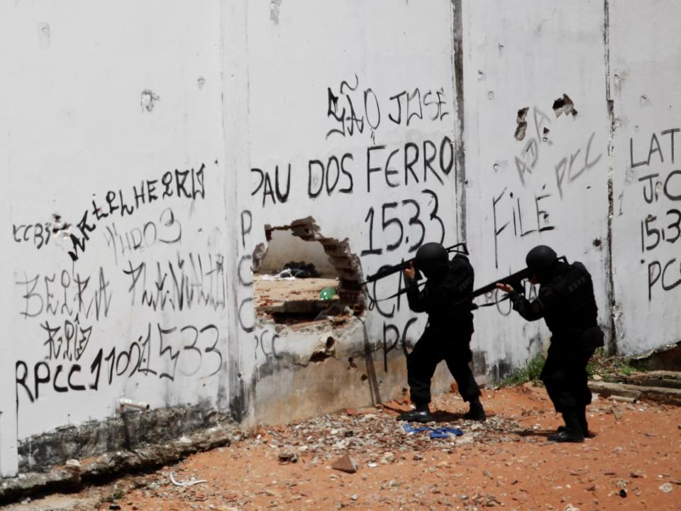 Riot policemen carry weapons during an uprising at Alcacuz prison in Natal, Brazil: Reuters