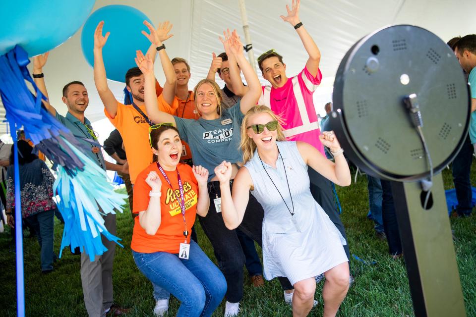 Pilot employees pose for a photo booth camera during a food truck event for employees at the Pilot headquarters in West Knoxville on Friday, May 20, 2022.