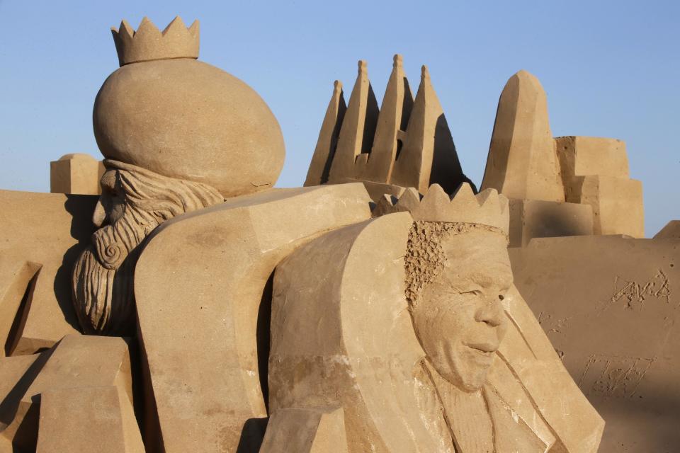 A nativity scene made of sand is seen on a beach in Salou