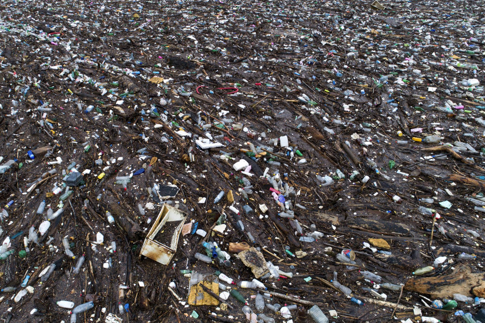 Waste floating in the Drina river near Visegrad, Bosnia, Friday, Jan. 20, 2023. Tons of waste dumped in poorly regulated riverside landfills or directly into the rivers across three Western Balkan countries end up accumulating during high water season in winter and spring, behind a trash barrier in the Drina River in eastern Bosnia. (AP Photo/Armin Durgut)