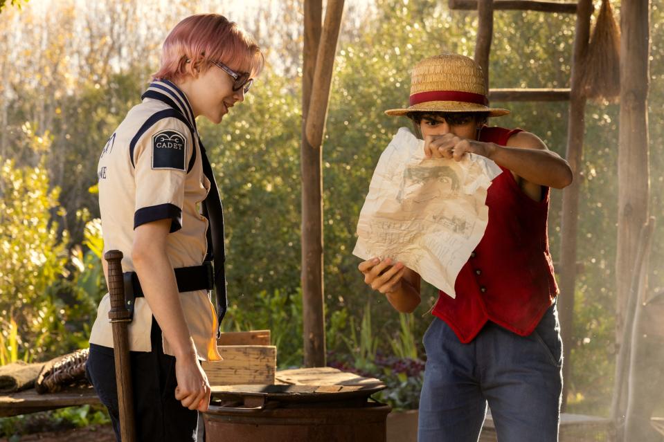 Monkey D. Luffy (Iñaki Godoy, right) proudly shows off his pirate wanted poster to friend Koby (Morgan Davies) in the first season finale of "One Piece."