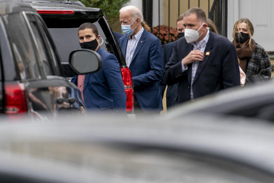 Democratic presidential candidate former Vice President Joe Biden leaves St. Joseph On the Brandywine Roman Catholic Church with his granddaughter Finnegan Biden, right, Sunday, Oct. 25, 2020, in Wilmington, Del. (AP Photo/Andrew Harnik)