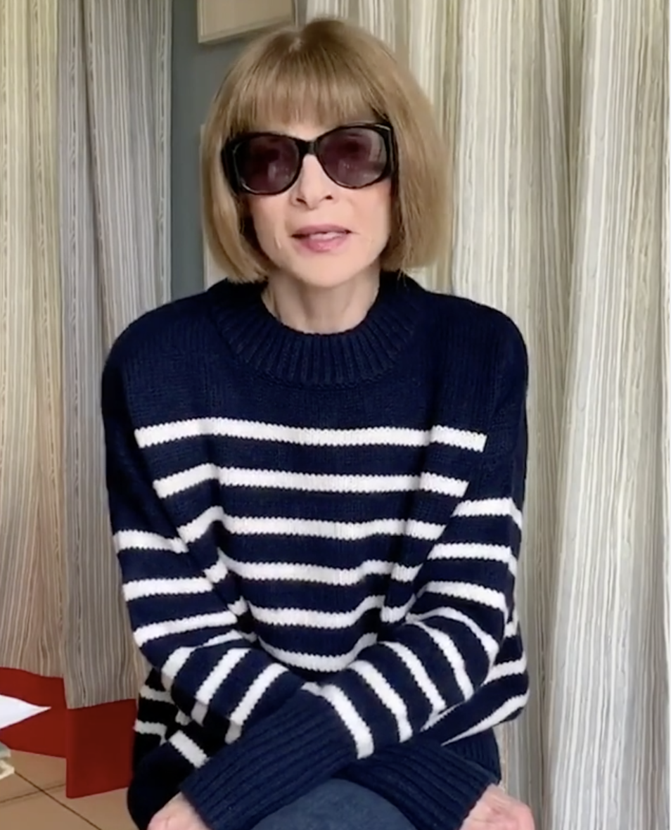 Anna Wintour in a striped top and oversized sunglasses