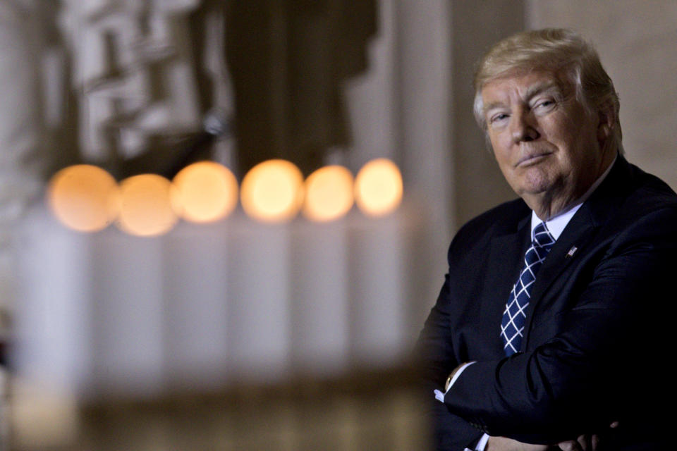 U.S. President Donald Trump sits near memorial candles after being lit at the Remembrance ceremony, hosted by the U.S. Holocaust Museum, in the U.S. Capitol Rotunda in Washington, D.C., U.S., on Tuesday, April 25, 2017. (Photo: Bloomberg via Getty Images)