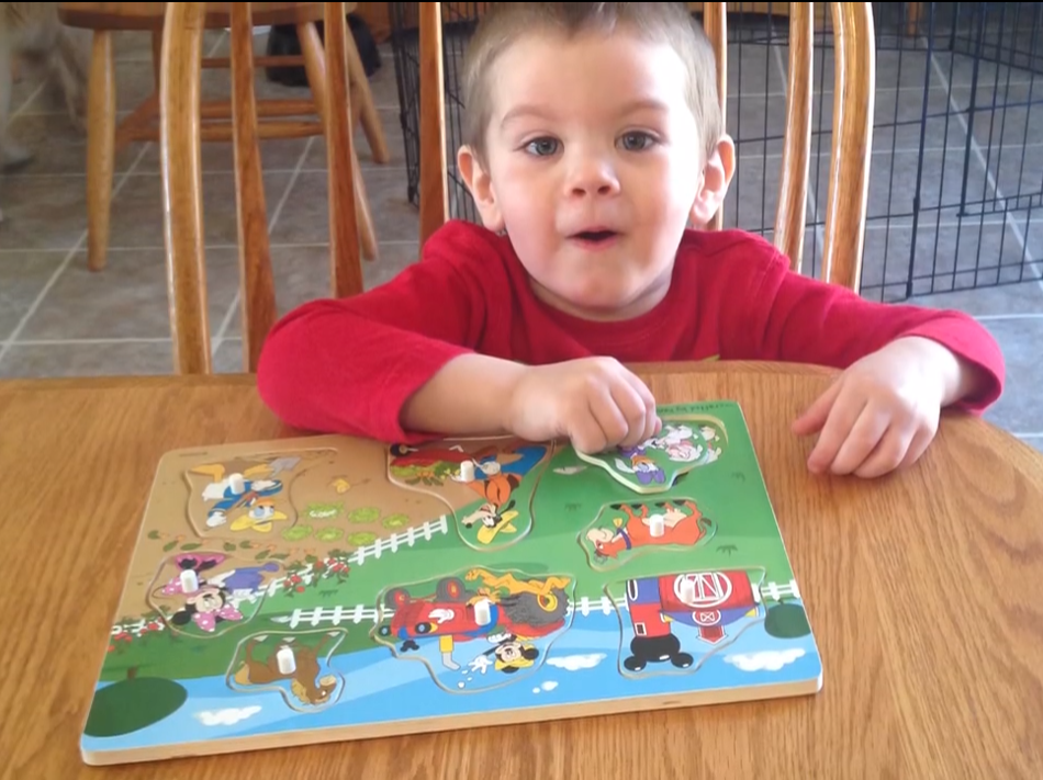 Matthew Maison completes a puzzle his grandmother bought for him.