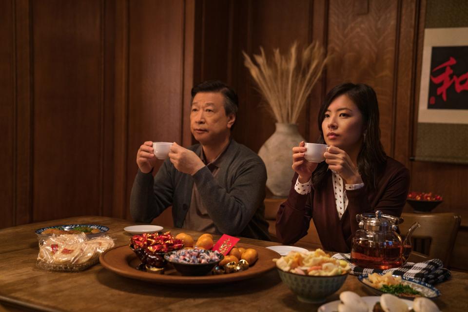 Years after leaving love behind in his homeland to go to America, an aging Taiwanese man (Tzi Ma, left) needs to come to grips with past decisions to connect with his daughter (Christine Ko) in the Netflix multigenerational drama "Tigertail."