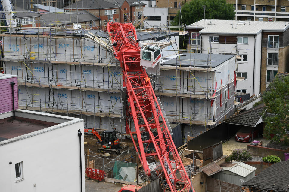 The scene in Bow, east London, where a 20-metre crane has collapsed on to a house leaving people trapped inside.