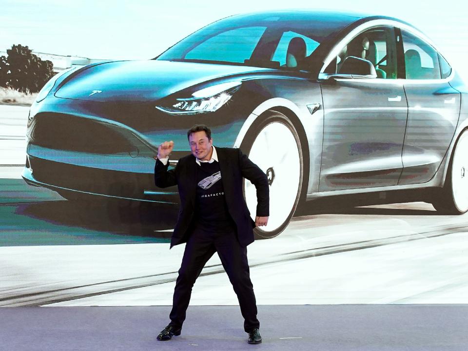  Tesla CEO Elon Musk dances onstage during a delivery event for Tesla China-made Model 3 cars in Shanghai, China 7 January, 2020 (Reuters)