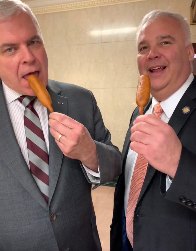 Assemblyman Joe Angelino (R-Chenango) and Assemblyman Matthew Simpson (R-Warren) enjoying a corn dog outside The Post’s capitol bureau. Vaughn Golden/NY Post