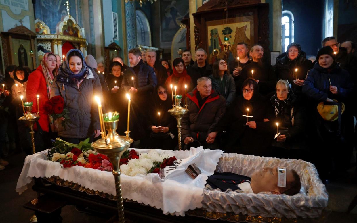 People pay their respects at the coffin of Alexei Navalny
