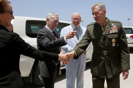 U.S. Defense Secretary James Mattis (2nd L), U.S. Embassy Charge d'Affaires Mark Boulware (2nd R) and other members of their delegation are greeted by U.S. Marine Corps General Thomas Waldhauser (R) as they arrive at Camp Lemonnier in Ambouli, Djibouti April 23, 2017. REUTERS/Jonathan Ernst