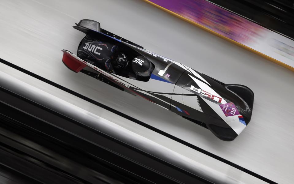 The team from the United States USA-1, piloted by Elana Meyers with brakeman Lauryn Williams, speed down the track during the women's two-man bobsled competition at the 2014 Winter Olympics, Tuesday, Feb. 18, 2014, in Krasnaya Polyana, Russia. (AP Photo/Michael Sohn)